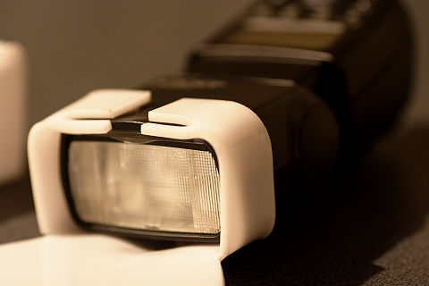 9. The little tabs are bent in slightly to prevent the diffuser sliding down the flash head