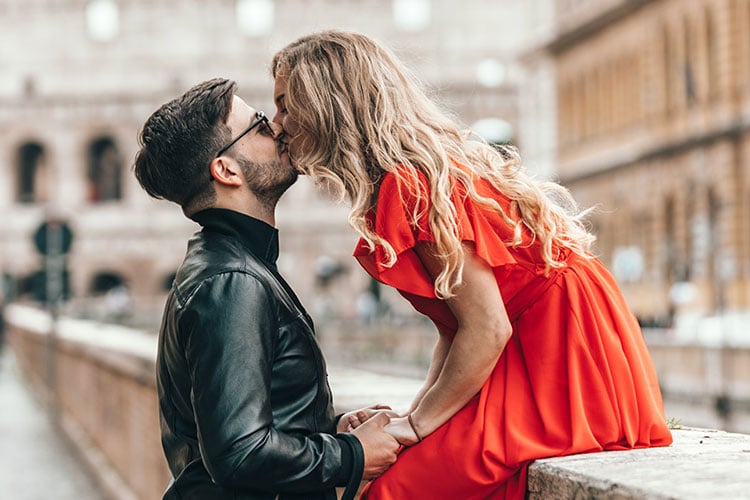 Happy casual couple embracing, posing to camera on yellow studio background  11134148 Stock Photo at Vecteezy