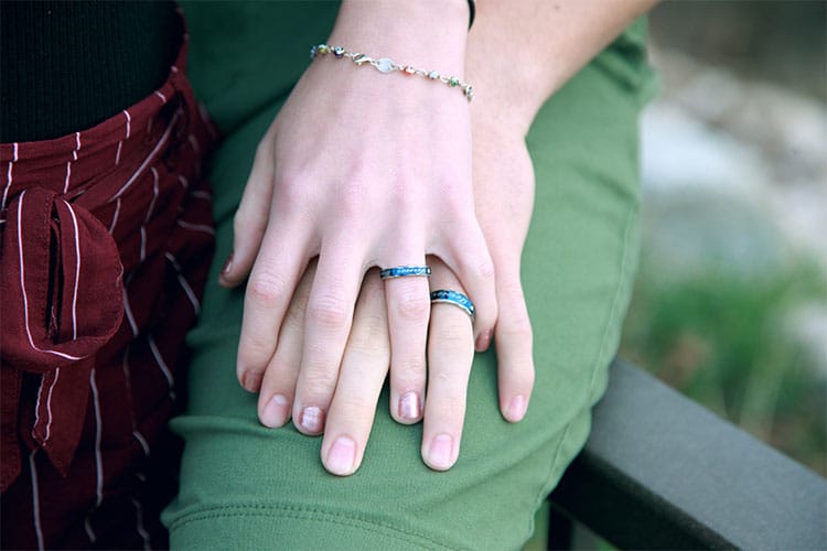 A Couple Holding Each Others Hand · Free Stock Photo